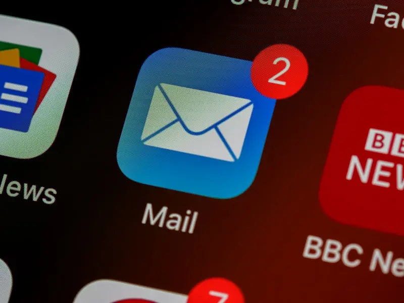 An email app icon with two unread messages on the phone screen