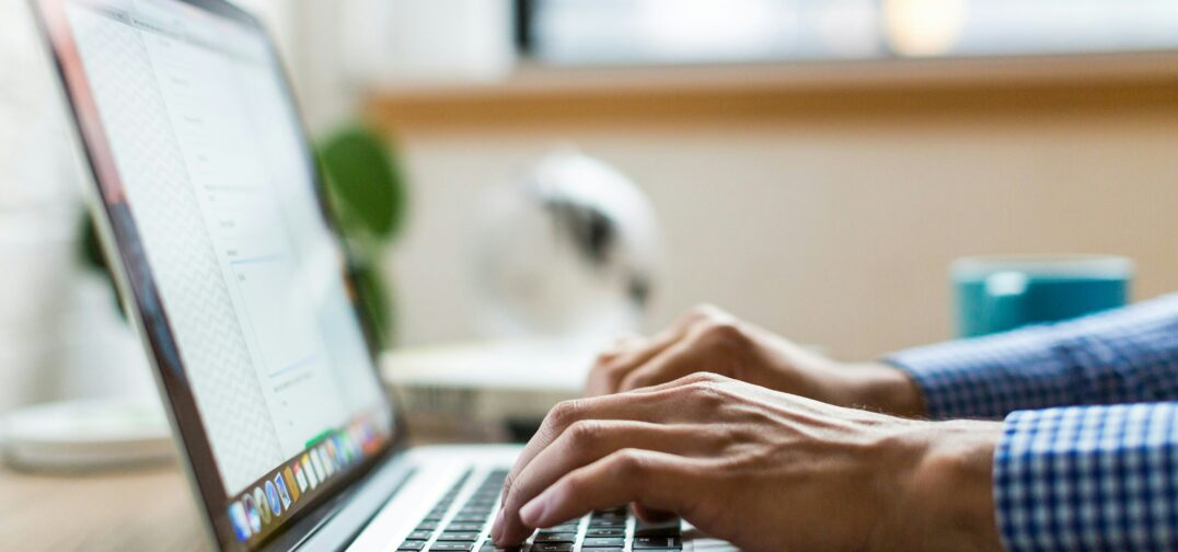 Person typing on laptop